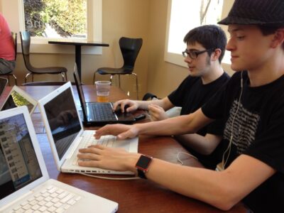 Students typing on computers