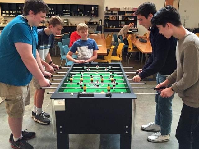 Students playing foosball