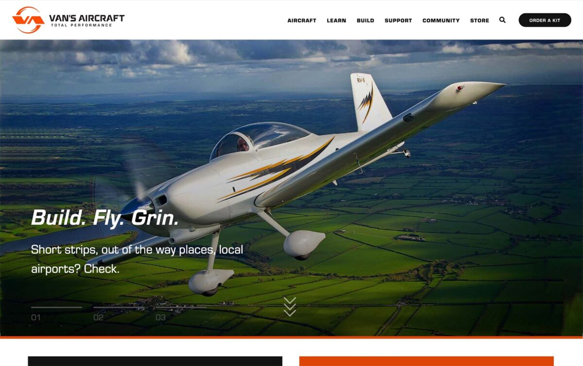 The Van's Aircraft website. home page featuring a close up of an airplane with lush fields in the background.